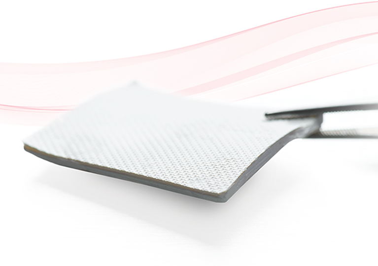 Image of tweezers holding OSSIX™ Volumax Membrane